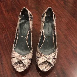 Snake printed BCBG Maxazria heels with platform. In excellent condition.